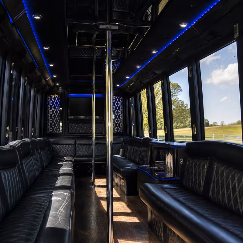Friends laughing during a Fort Lee party bus celebration