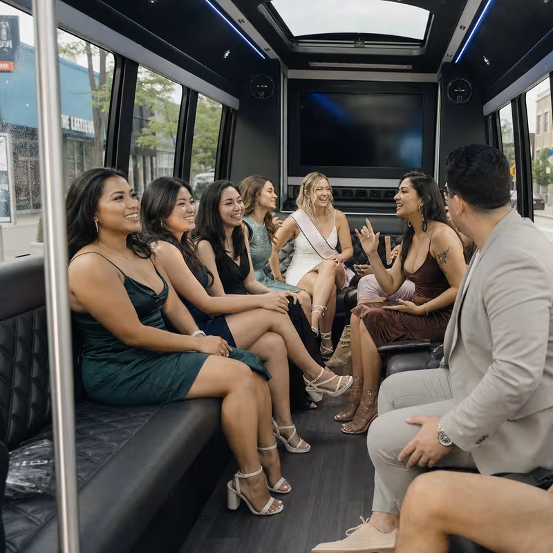 Party bus interior with wraparound leather seating and LED lighting in Fort Lee