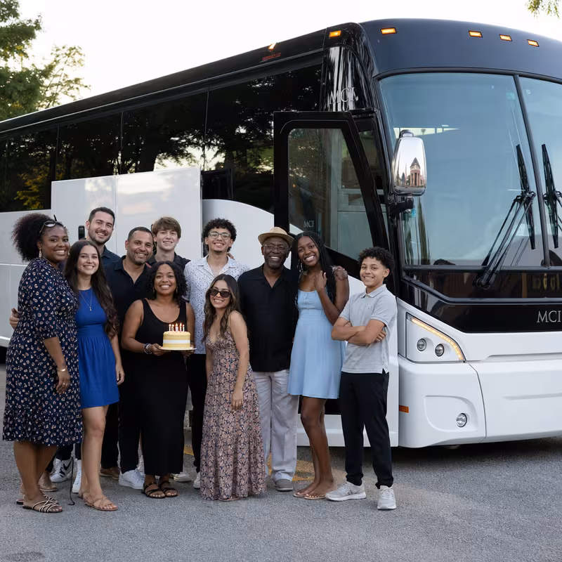Passengers loading luggage while boarding an Fort Lee group shuttle