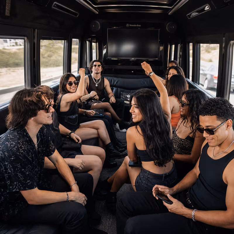 Group boarding a white charter bus for Concert Transportation transportation in Fort Lee