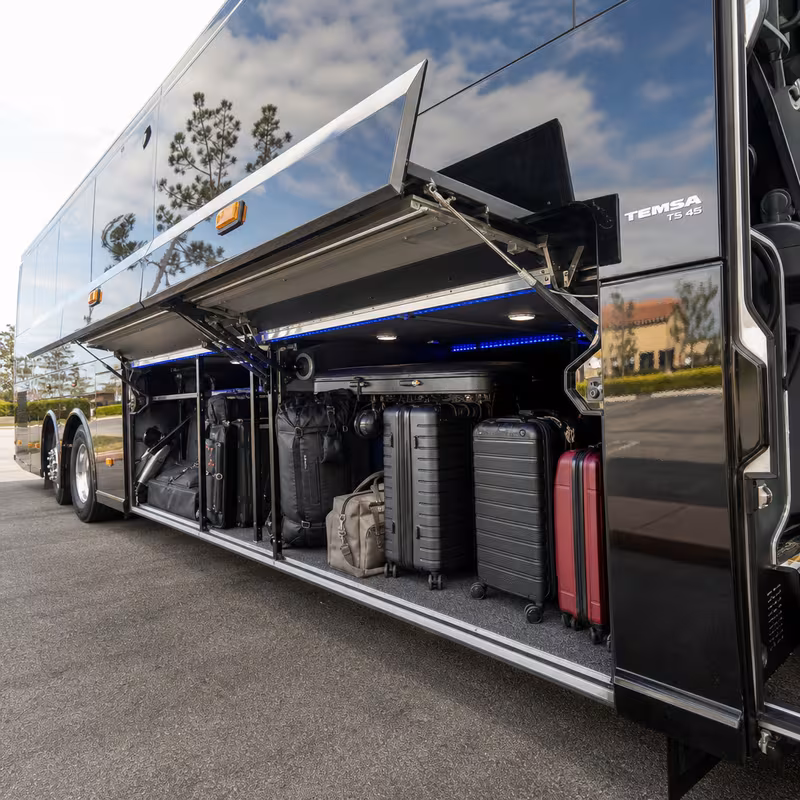 Party bus interior with wraparound leather seating and LED lighting in Fort Lee