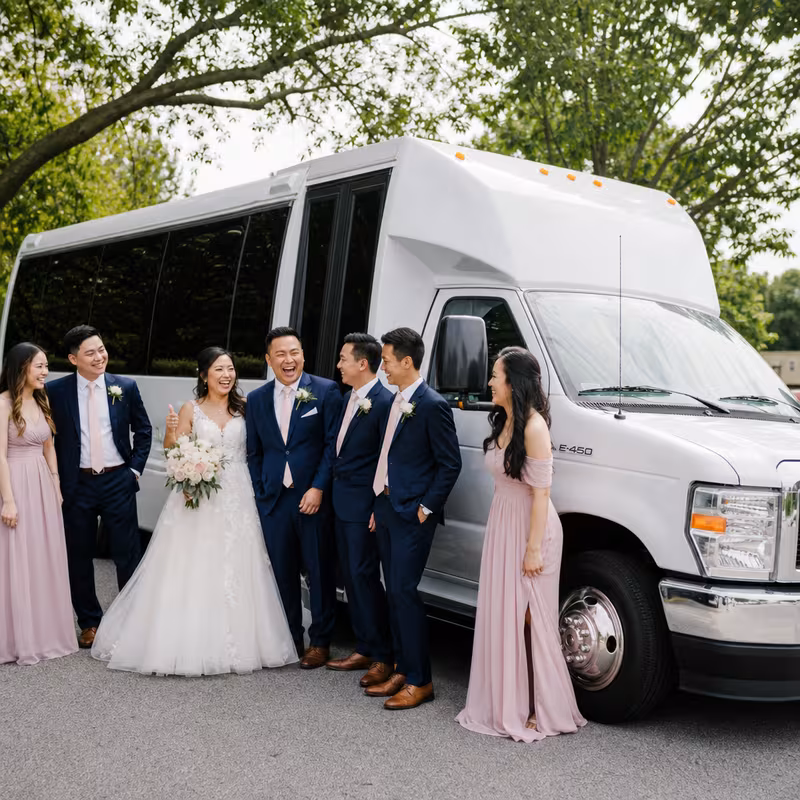 Passengers loading luggage while boarding an Fort Lee group shuttle