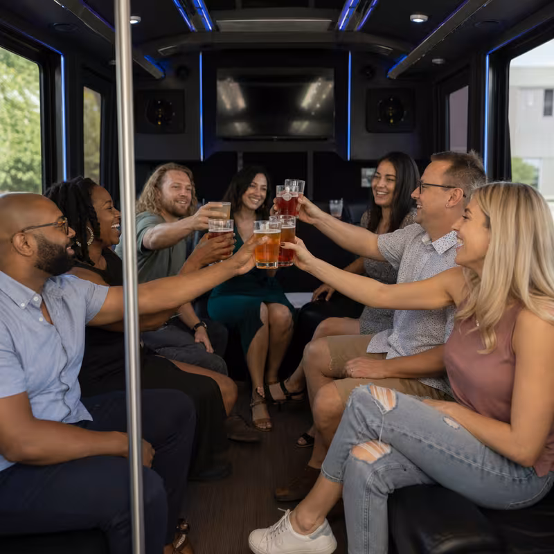 Group boarding a white charter bus for Winery & Brewery Tour Transportation transportation in Fort Lee
