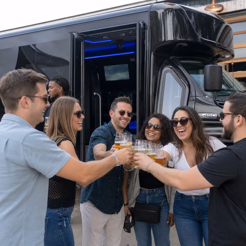 Passengers loading luggage while boarding an Fort Lee group shuttle